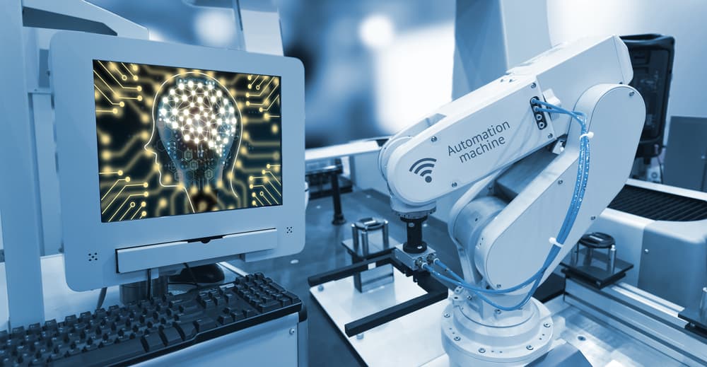 Edge computing for machine learning is visualized as an artificial brain on the monitor of a remote industrial machine