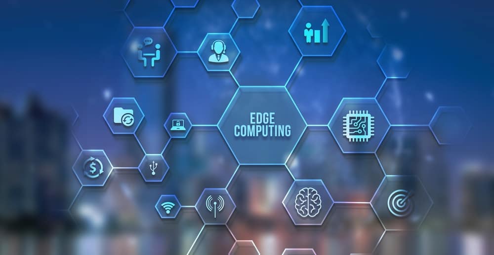 Edge Computing is at the center of a network of hexagons containing icons of edge computing concepts. Edge Computing is at the center of a network of hexagons containing icons of edge computing concepts.