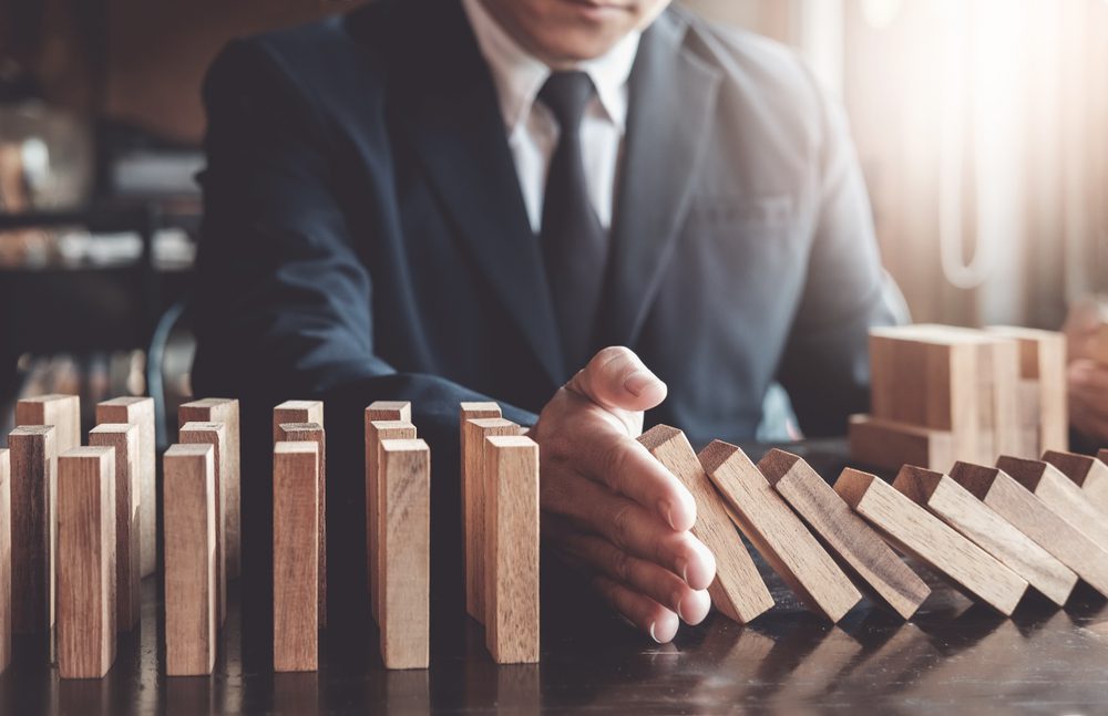 Business,Risk,Control,Concept,,Businessman,Protect,Wooden,Block,Fall,To Business,Risk,Control,Concept,,Businessman,Protect,Wooden,Block,Fall,To